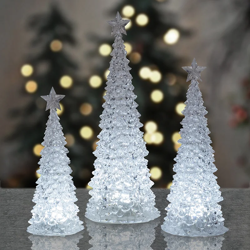 White tree-shaped decorations with textured branches and star-shaped toppers.