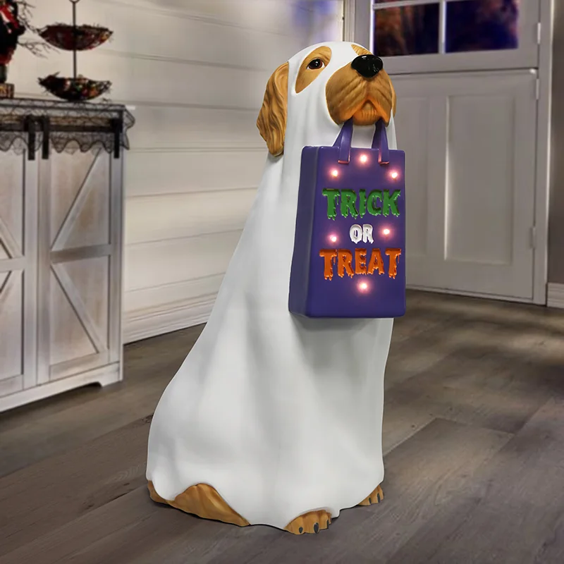 Dog character in a white ghost costume carrying a Trick or Treat bag.