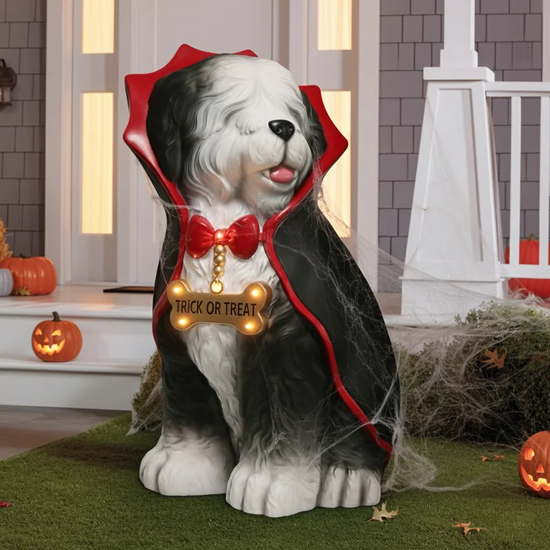 Shaggy dog decoration wearing a black vampire cape with red trim.