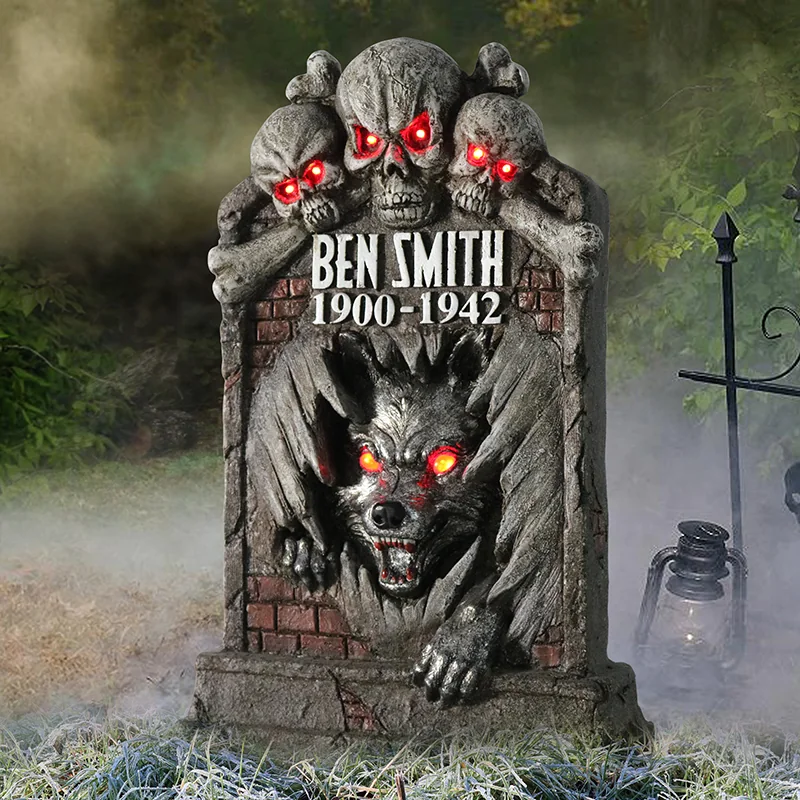 Decorative tombstone with a winged creature, sculpted textures and a wolf-shaped face.